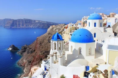 Feel santorini’s postcard beauty with a small group tour to oia’s blue domes, the summit at profitis ilias monastery, and black sands of perissa. includes pickup.