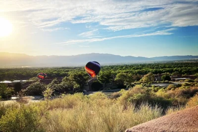 Float above albuquerque’s rio grande valley with a flexible launch site, private or group flight options, and mimosas after landing. includes pickup.