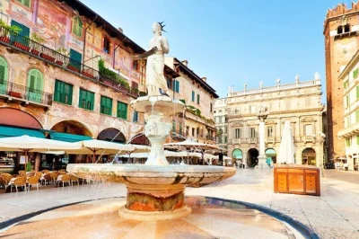 Vivi verona con una passeggiata in piccolo gruppo guidata da un locale. scopri il balcone di giulietta, le piazze animate e le rovine romane. incluso il transfer.