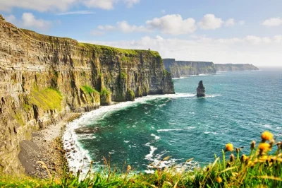 Feel the wild atlantic wind at the cliffs of moher, wander the burren’s limestone, explore aillwee cave, and snap dunguaire castle—all with pickup from galway.