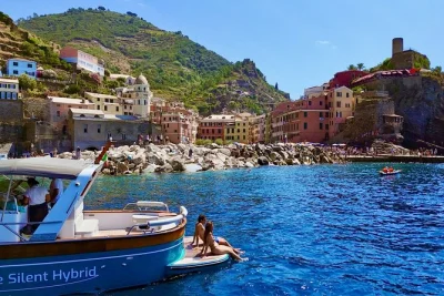 Feel the sea breeze on a cinque terre boat tour from monterosso, with swimming in hidden bays, local aperitif, and small group comfort. includes drinks & guide.