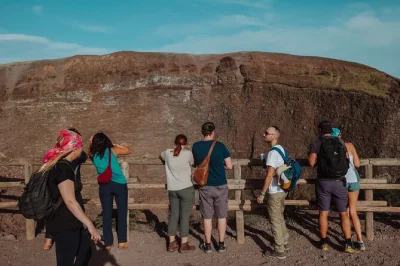 Step onto mount vesuvius from pompeii with a local hiking guide, skip-the-line entry, and minibus transfer. peer into the crater and catch naples views—includes all fees.