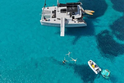 Sail from heraklion to dia island on a semi-private catamaran. swim, try water sports, and enjoy a fresh cretan lunch with local wine. includes drinks and pickup.