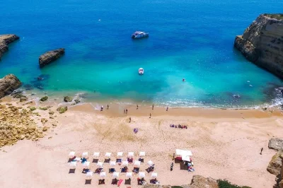 Sail from albufeira to benagil cave, relax with a seaside bbq and open bar, and enjoy hidden beaches. includes lunch, drinks, and local guide onboard.