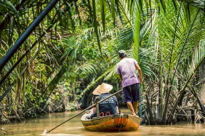 Float the mekong delta by boat & sampan, sample coconut candy, and visit vinh trang pagoda with lunch included. small group tour from ho chi minh city.