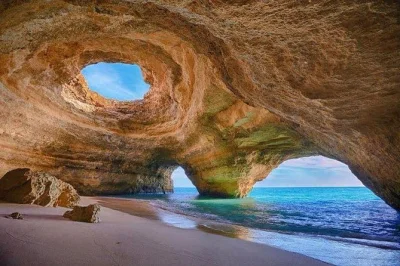 Step inside benagil cave by boat from portimao, swim at marinha beach, spot dolphins, and explore sea caves with a small group and live guide. includes life jacket.