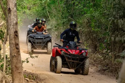 Feel the rush on a jungle atv ride, swim in a clear cenote, and wander puerto morelos with snacks included—hotel pickup makes it easy to book.
