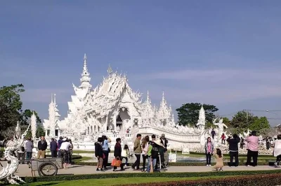 Start your chiang rai day trip with hotel pickup, see the white temple, blue temple, black house, long neck village, and golden triangle. includes lunch & local guide.