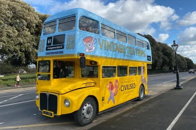 Step onto a vintage bus in dublin for afternoon tea, city sights like trinity college & phoenix park, and stories from your local guide. includes pickup & snacks.