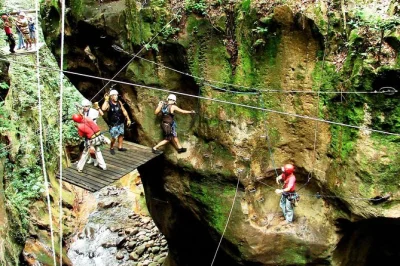 Feel the rush on rincon de la vieja with ziplining, river tubing, horseback riding, a full buffet lunch, and hot springs. includes hotel pickup and local guide.
