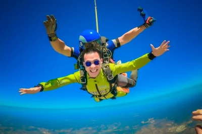Leap from 15,000ft above algarve with a tandem skydive near faro, freefall over the coast, and float down with expert instructors. includes all gear and insurance.