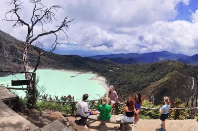Feel the sulfur mist at kawah putih, cross the south bandung suspension bridge, soak your feet in hot springs, and enjoy a lakeside pinisi ship lunch with hotel pickup.