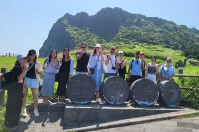 Feel the sea air at hamdeok beach, watch jeju’s haenyeo divers up close, hike seongsan ilchulbong, and stroll seongeup folk village—all with transfers included.