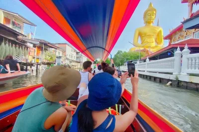 Glide through bangkok’s thonburi canals by longtail boat, spot the giant buddha at wat paknam, and wander khlong bang luang’s riverside art community. small group tour.