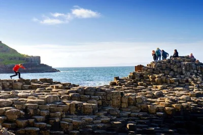 Start in dublin, ride a belfast black cab, sign the peace wall, and walk the giant’s causeway cliffs. includes pickup, local guide, and all entry fees.