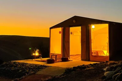 Sleep under the stars in agafay desert near marrakech, enjoy a deluxe tent, moroccan dinner, pool access, and live show. includes pickup and breakfast.