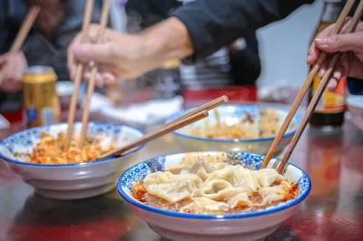 Hop into a tuktuk for a chengdu food tour through family-run spots, street crepes, noodles, and a retro bar. includes unlimited drinks and english-speaking guide.