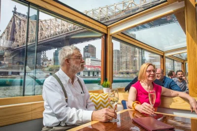 Step onto a 1920s-style yacht in manhattan for a narrated architecture cruise, passing the statue of liberty, brooklyn bridge, and more. includes drink & expert guide.