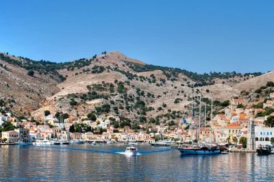 Arrive in symi by fast boat from rhodes, spend four hours wandering pastel harbors, tasting local food, or swimming. includes ticket and optional pickup.