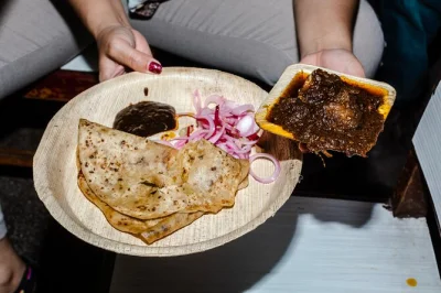 Follow a local guide in kolkata to taste 13+ bengali dishes, ride a wooden rickshaw, and end at a historic coffee house. small group tour with subway ride included.