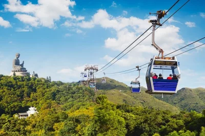 Hear monks chanting at big buddha, taste snacks in tai o village, and ride the ngong ping 360 cable car—includes city center pickup and local guide support.