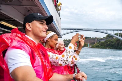 Feel the spray from niagara falls on a small group tour with skylon tower views, journey behind the falls tunnels, and a seasonal boat cruise—includes skip-the-line entry.
