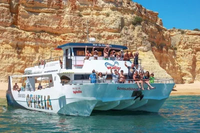 Feel the algarve breeze on a catamaran cruise to benagil cave, wander hidden grottoes, and share a beach bbq lunch. includes wifi, drinks bar, and local guide.