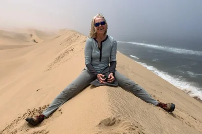 Feel the wild contrast of namibia’s sandwich harbour dunes meeting the atlantic, spot flamingos at walvis bay, and ride with a local guide—includes snacks & drinks.