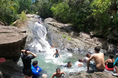 Feel the rush of el yunque’s natural waterslides, swim under waterfalls, and taste puerto rican street food at luquillo beach. includes ac transport and lunch.