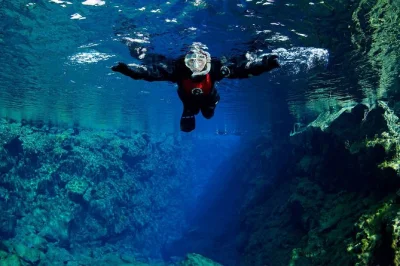Float between continents at silfra, snorkeling in crystal-clear water with a small group and expert guide. includes reykjavik pickup, drysuit, and hot cocoa after.