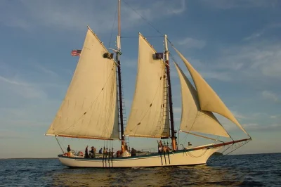 Watch the sun dip behind mount battie on a classic camden sunset sail. sail past curtis island light, spot wildlife, and relax with drinks—includes local crew.