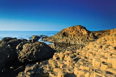 Feel the wild coast on a small-group giant’s causeway day trip from belfast, with stops at bushmills distillery, dunluce castle, and the dark hedges. includes pickup.