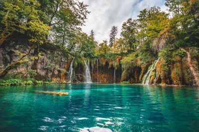 Lose track of time wandering plitvice’s vivid lakes, caves, and trails on a guided day trip from split. includes panoramic boat ride, electric train, and transfers.