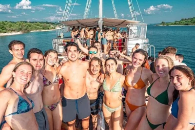 Feel the pulse of split on a boat party with live dj, blue lagoon swim stop, affordable bar, and free club entry—includes hosts and welcome shots.