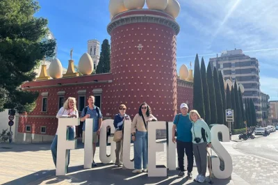 Step into girona’s old streets, walk the city walls, and dive into dalí’s surreal world in figueres—small group tour with barcelona hotel pickup included.