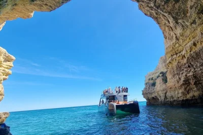 Feel the ocean breeze as you cruise from albufeira to benagil cave, explore dramatic algarve cliffs, and swim off the boat—includes marina departure and local guide.