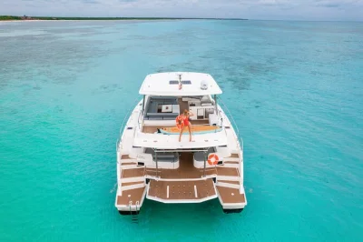 Set sail from puerto aventuras on a private tulum yacht charter with chef-prepared dining, open bar, and snorkeling gear. includes water toys and local crew.