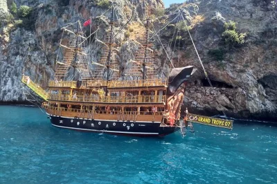 Set sail from alanya on a pirate boat, swim in hidden caves, and enjoy lunch with unlimited drinks. includes hotel transfer and a friendly local crew.