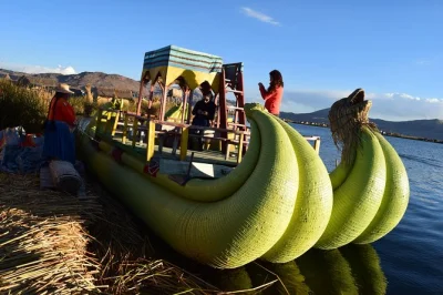 Step onto floating reed islands, meet uros locals, and hike taquile for a lakeside lunch on this lake titicaca day trip from puno—includes hotel pickup and fast boat.