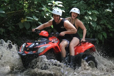 Feel the mud, laughter, and river spray on bali’s top atv quad bike and ayung rafting day tour, including hotel pickup, lunch, and all safety gear.