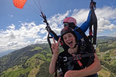 Feel the wind above medellin with a tandem paragliding flight, soaring over the city and green mountains. includes certified instructor, all equipment, and insurance.