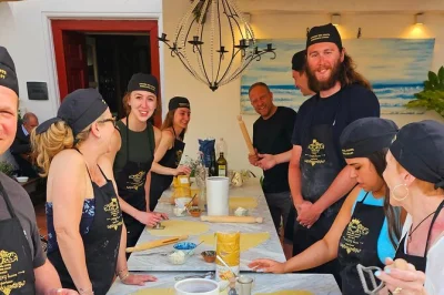 Step into a sorrento villa for a hands-on pizza and pasta class, taste homemade limoncello, and enjoy dinner on a sea-view terrace. includes coastal pickup.