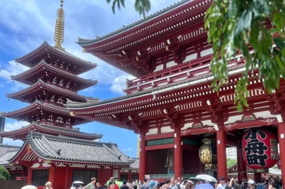 Step into tokyo’s asakusa district, walk under kaminarimon, taste fresh street snacks, and explore sensoji temple with a guide. entry included, easy booking.