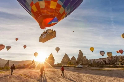 Float above cappadocia’s fairy chimneys at sunrise, with hotel pickup, snacks, and a post-flight celebration. includes flight certificate and flexible rebooking policy.