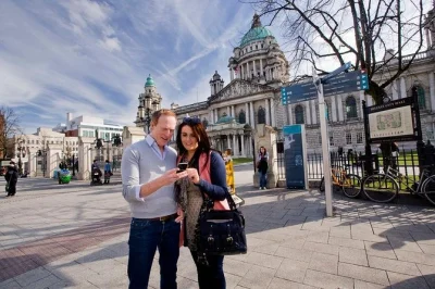 Feel the wild beauty of giant's causeway, cross dunluce castle’s bridge, and explore belfast’s murals on a day trip from dublin with spanish-speaking guide and pickup.