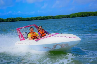 Feel the rush of piloting your own speedboat through nichupté lagoon, snorkel vibrant reefs, and share a mayan ceremony—includes lunch and all equipment.