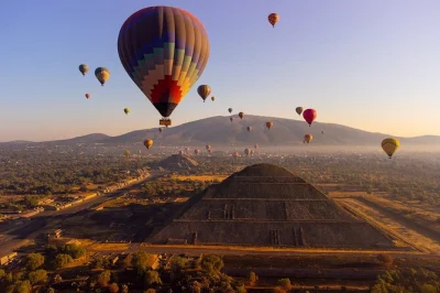 Float above teotihuacan’s pyramids at sunrise, enjoy breakfast in a cave, and explore the ruins at your pace. includes pickup from mexico city and local guide.