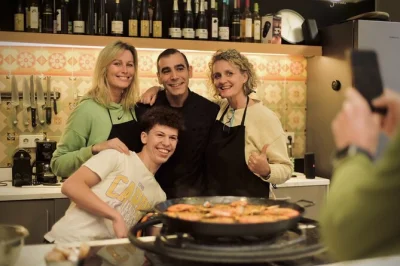 Follow a barcelona chef through la boqueria market, cook paella and tapas, share sangria, and take home recipes. includes hands-on class and market visit.