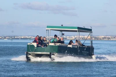 Feel the calm of ria formosa on a small catamaran tour from faro, stopping at deserta, farol & culatra islands plus an oyster farm visit. includes snorkeling gear & local guide.
