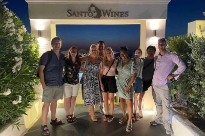 Watch the santorini sunset at santo winery, taste local wines with a greek guide, enjoy island tapas, and relax with hotel pickup on this unique wine tour.